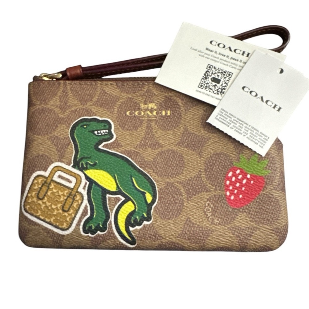 Coach Tan Wristlet with Dinosaur and Strawberry Design